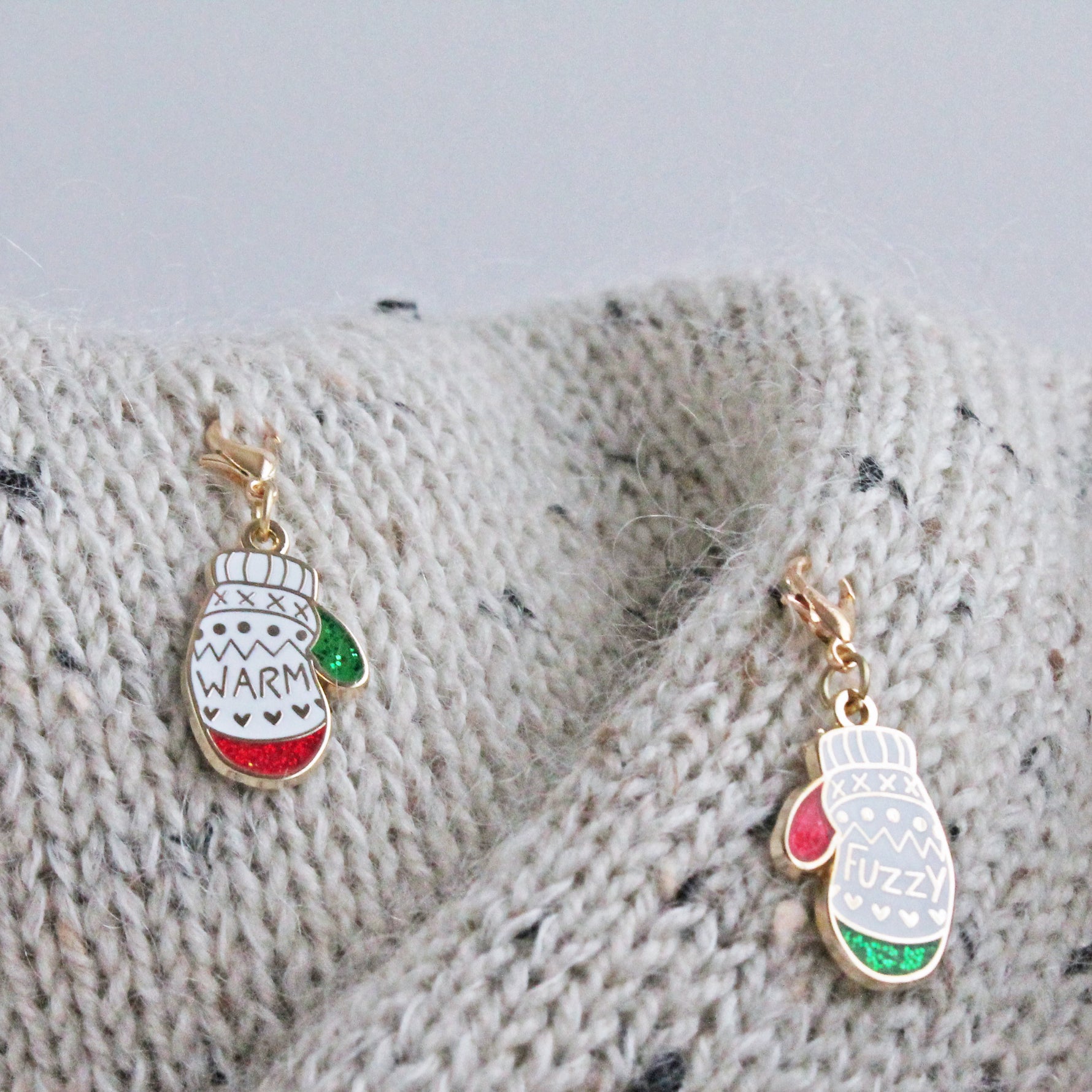 Progress Keeper Set of two 'Warm & Fuzzy' Mittens in light purple and mint. These hard enamel charms make cute and functional knitting accessories that can also be used as stitch markers