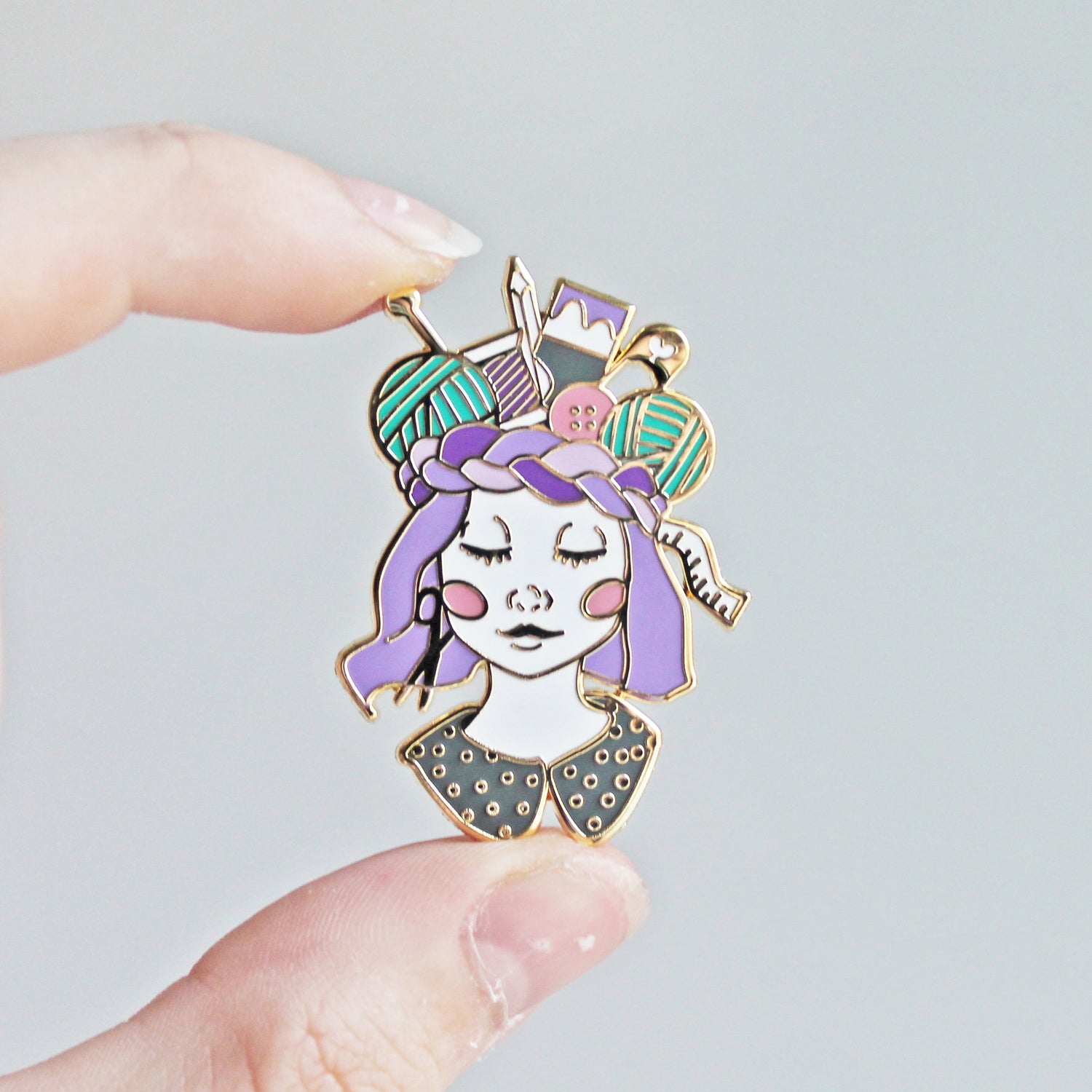 Unique pin for crafters, makers, knitters and crocheters. This creative enamel pin features a girl with a crown of craft supplies, available in multiple skin tones.