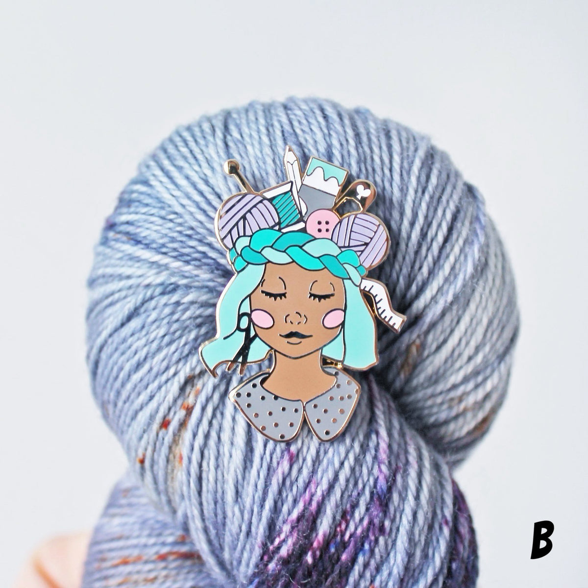 Unique pin for crafters, makers, knitters and crocheters. This creative enamel pin features a girl with a crown of craft supplies, available in multiple skin tones.