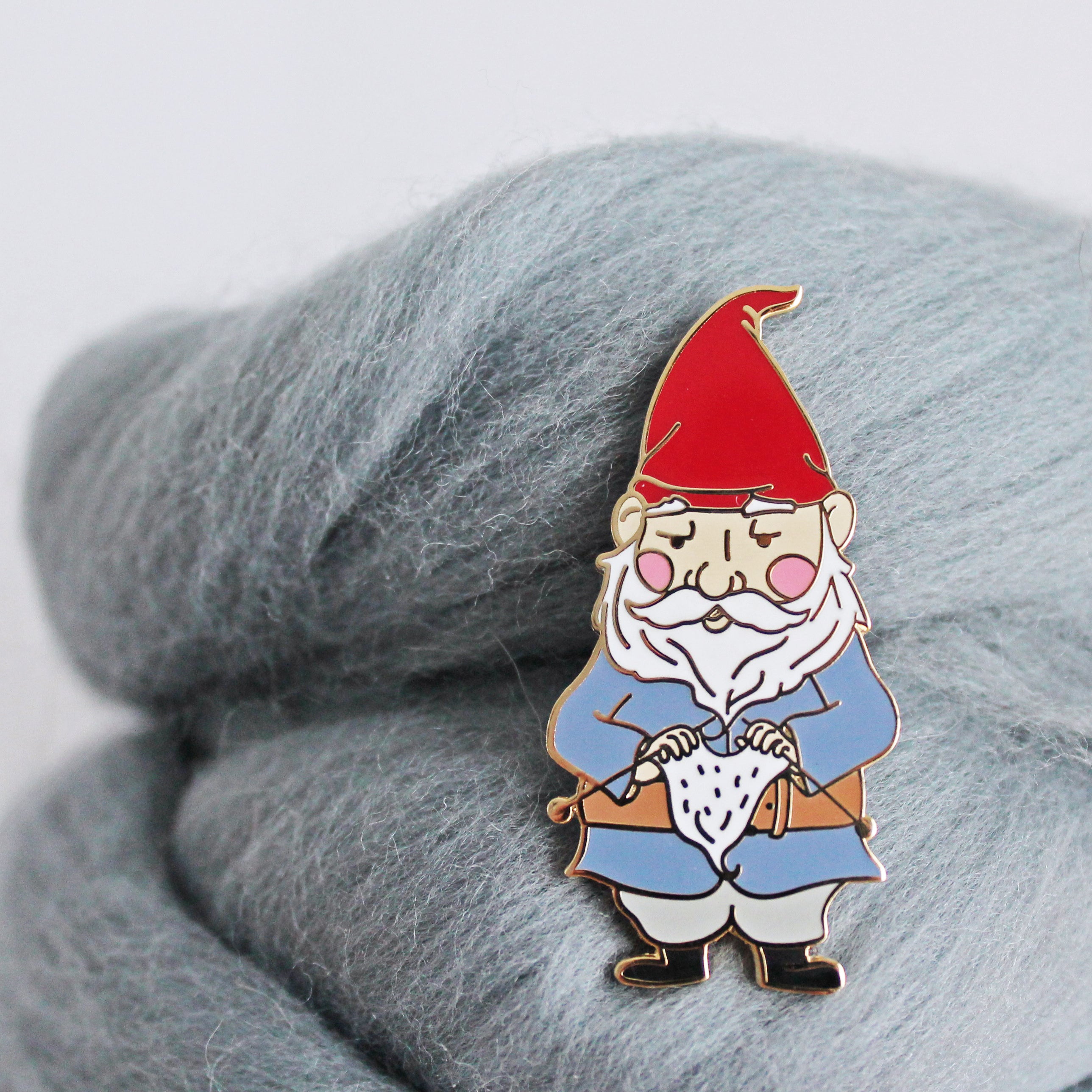 Cute knitting gnome pin for knitters and gnomies. Unique enamel pin design, an adorable knitting accessory perfect for your project bag.