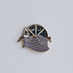 Unique spinning enamel pin for knitters. 'Moon Phase' spinner knitting pin, for knitters can pass the night knitting. A fun knitting accessory for any project bag!
